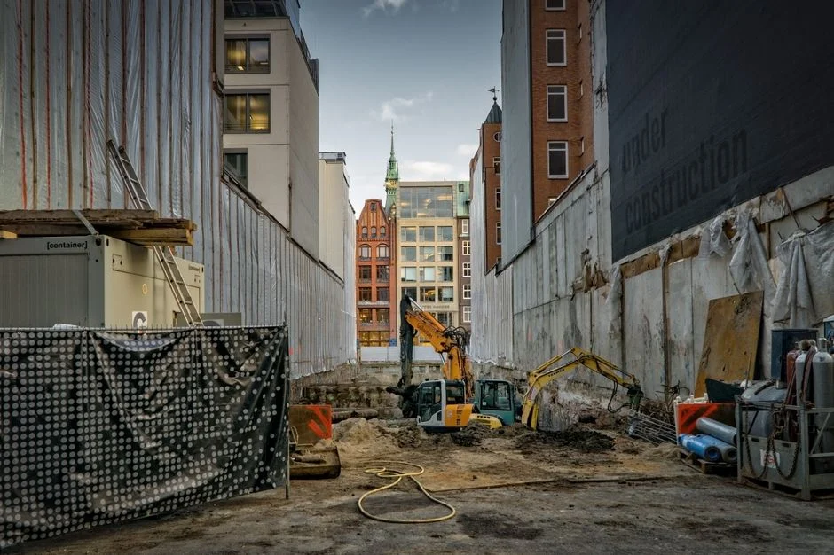 Construction workers on a building site with scaffolding